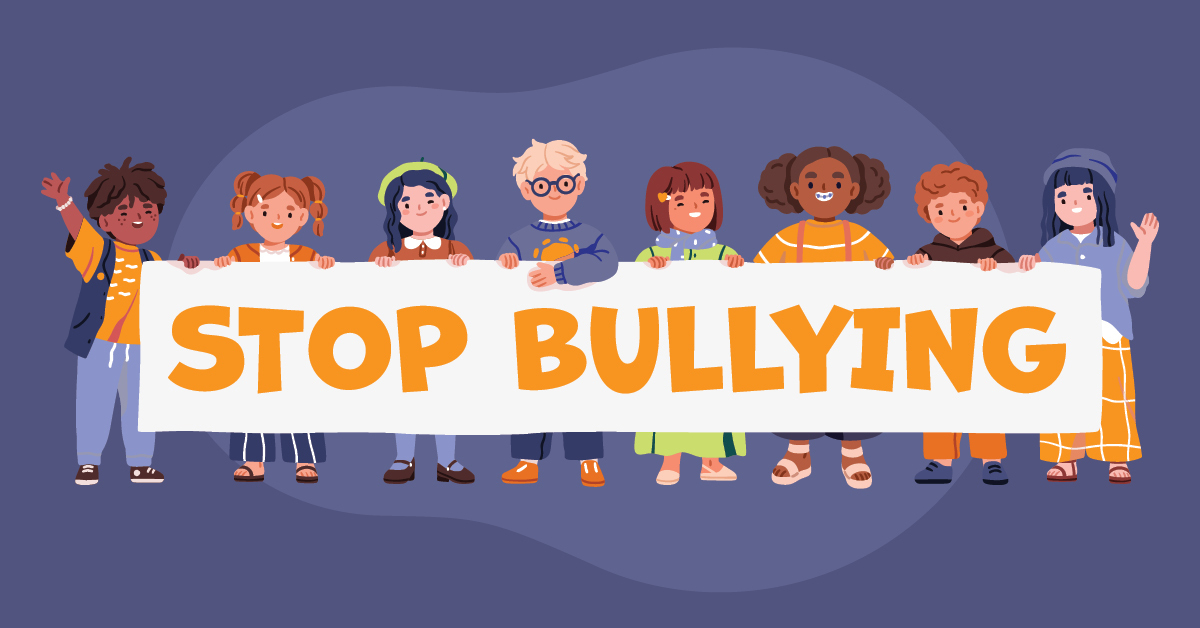 kids holding a stop bullying sign