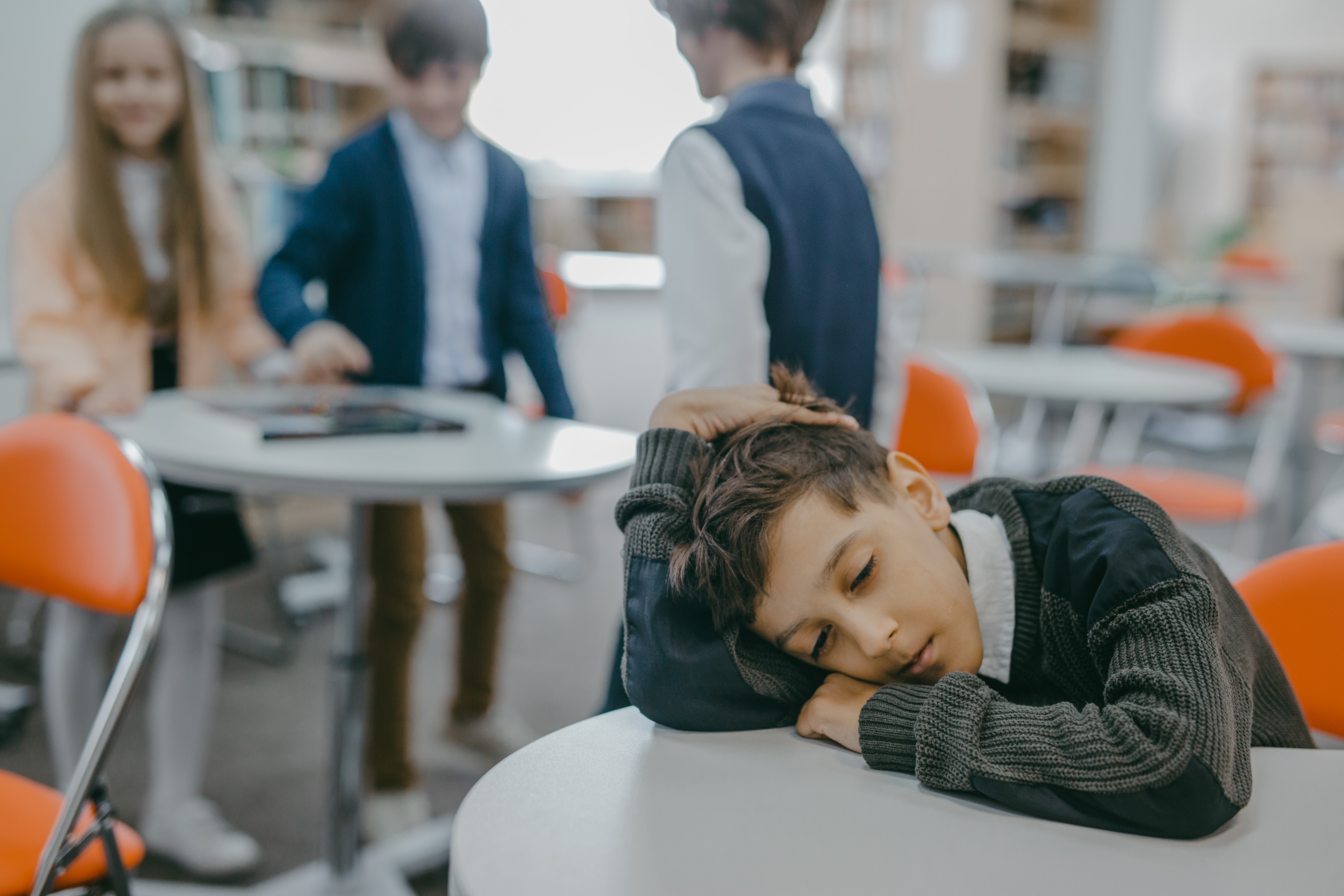 Student with head down on desk