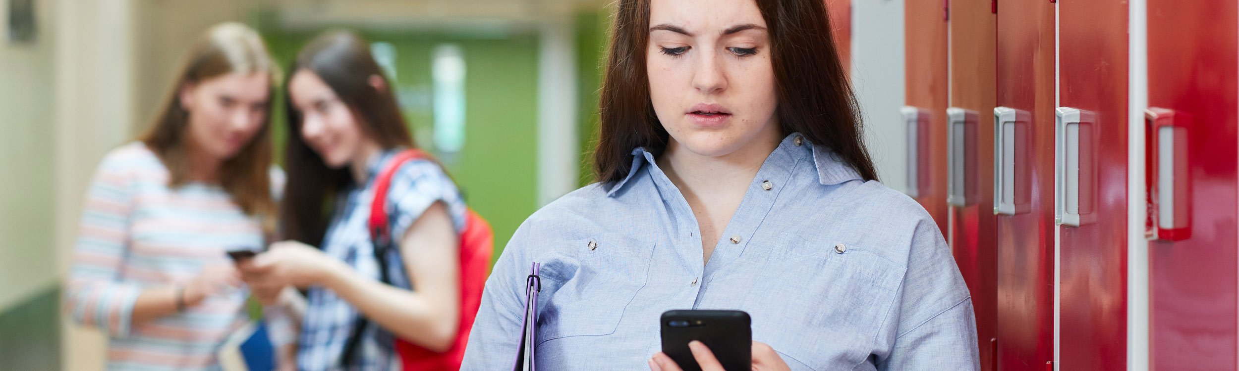 Female students with mobile devices