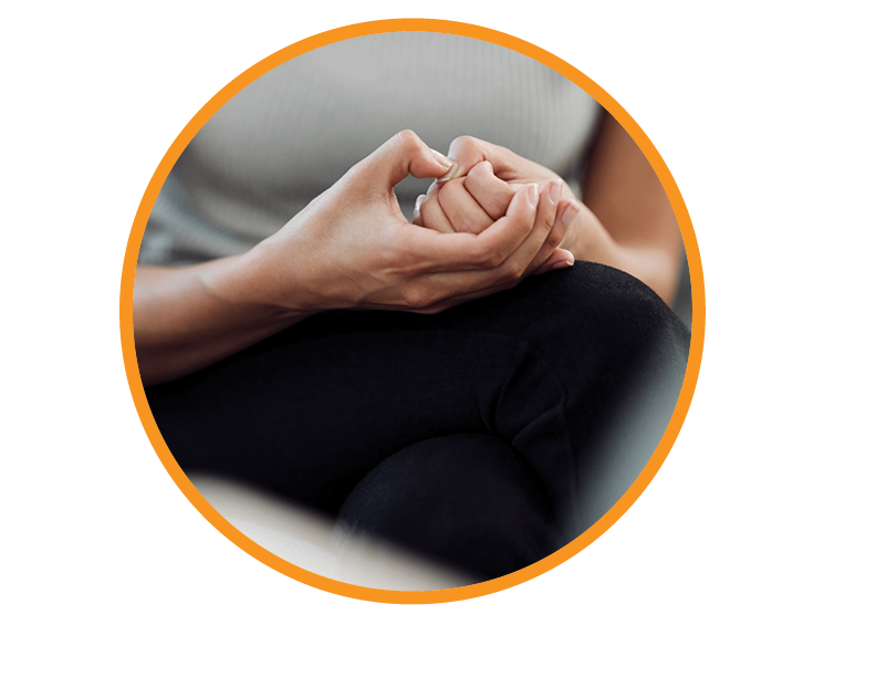 Hands on lap symbolizing anxiety