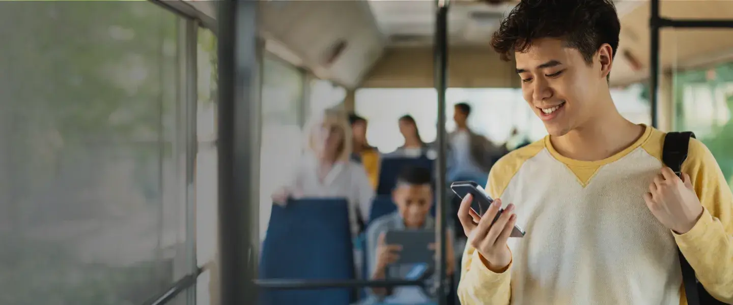 Teenager looking at cell phone.
