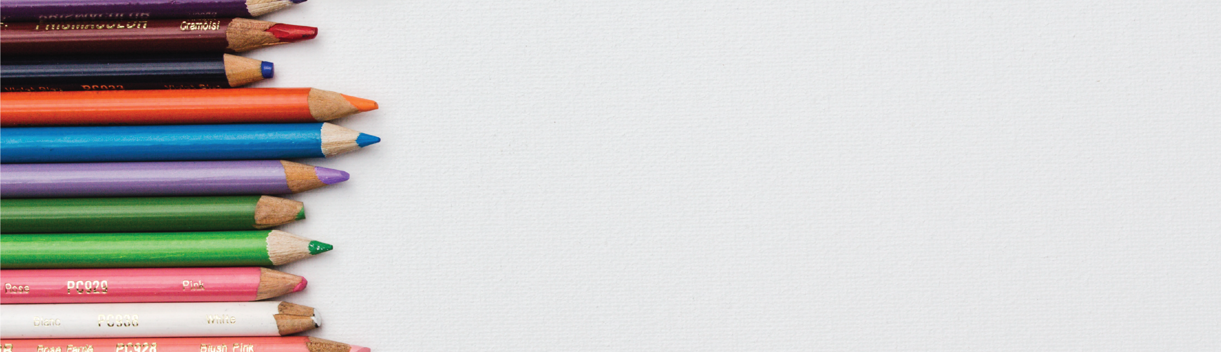 Colorful pencils, blank page