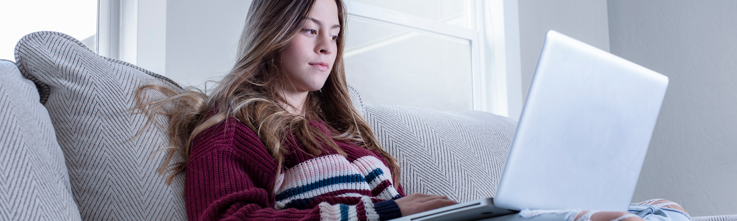 Student at home on laptop