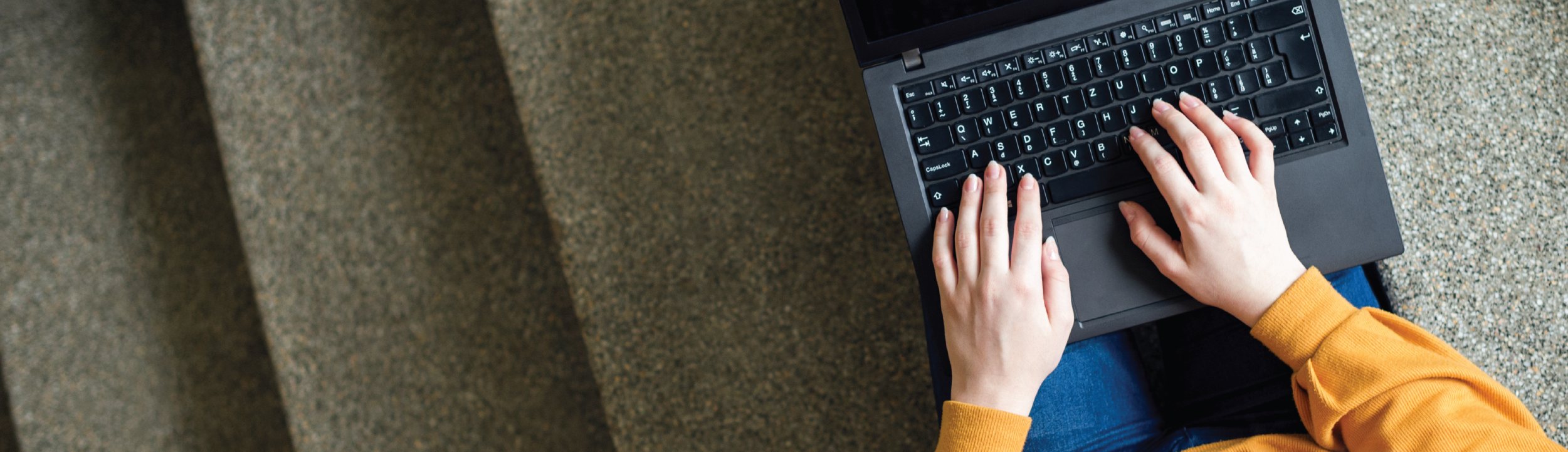 Typing on laptop