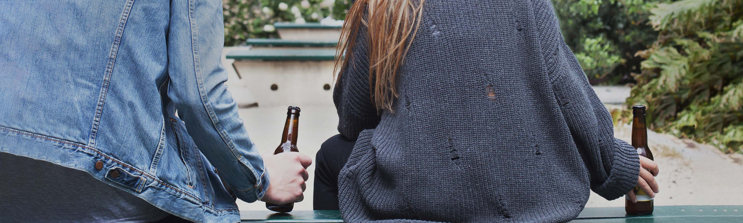 Students on bench with alcohol