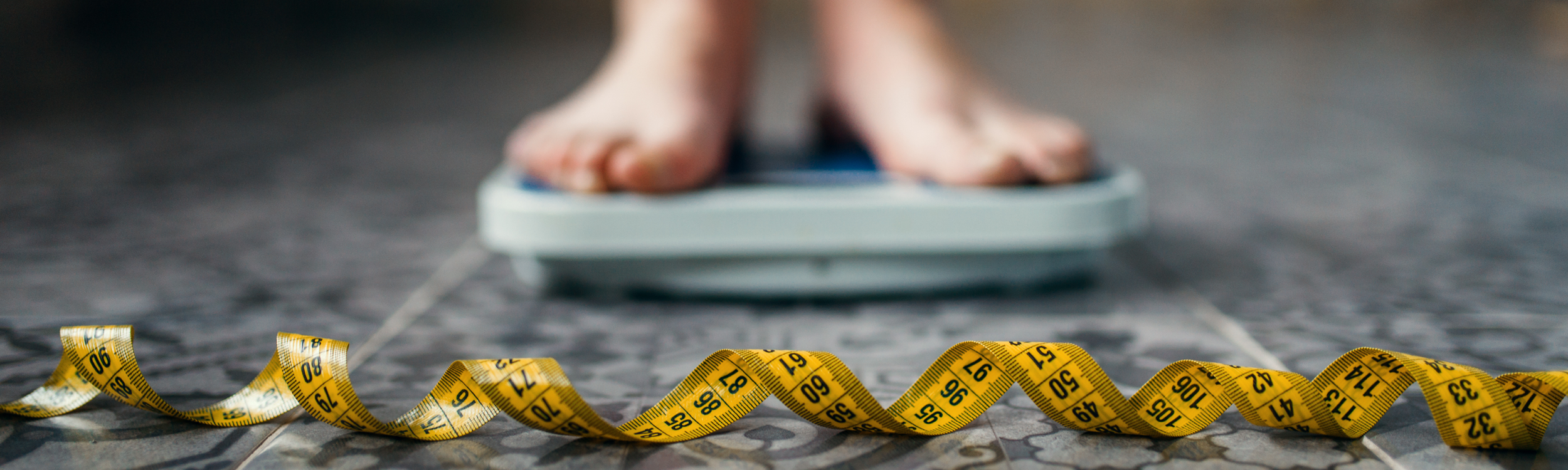 Feet on scale with measuring tape