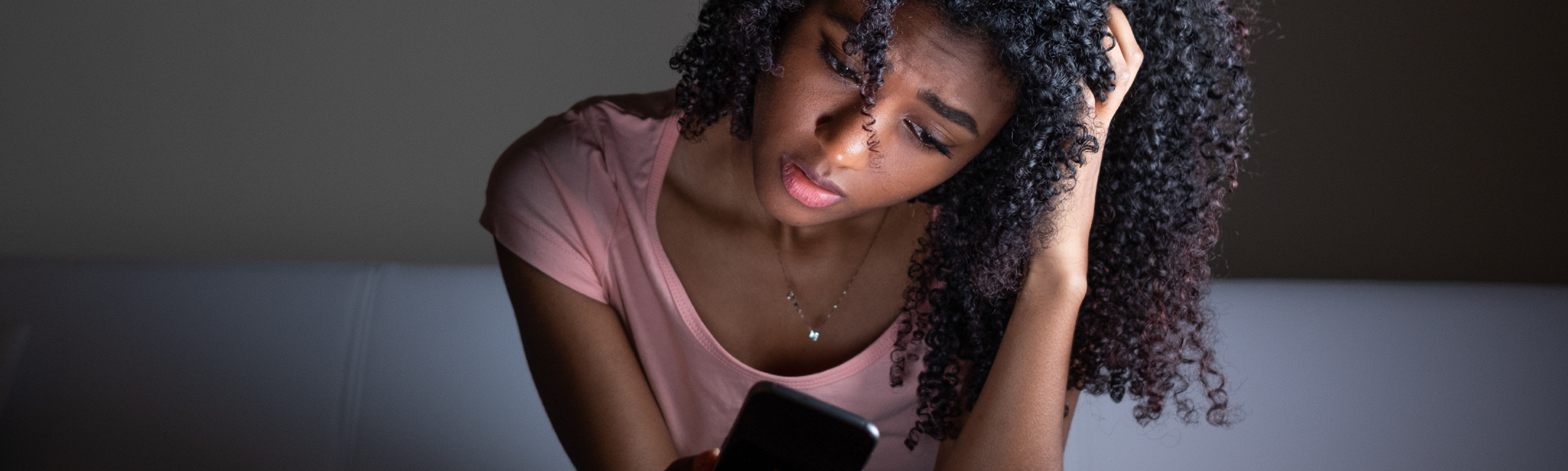 Worried female looking at phone