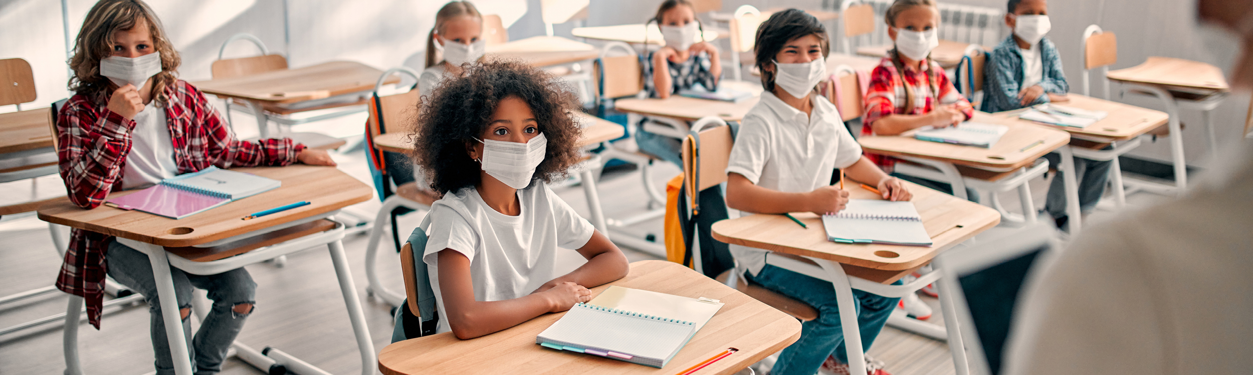 Students in classroom wearing masks