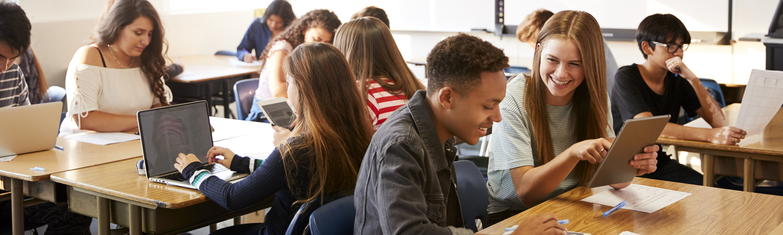 Students learning on devices