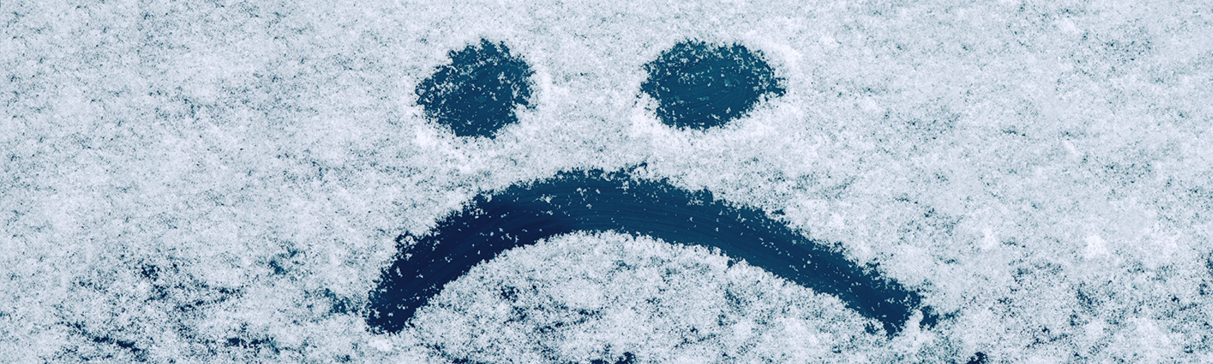 Sad face in snow